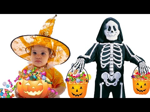 Sami and Amira Pretend Play Halloween Trick or Treat Candy Haul