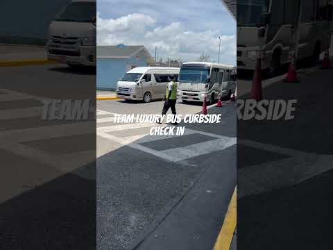 Transportation curbside check in by T.E.A.M Luxury Transportation—Jamaica
