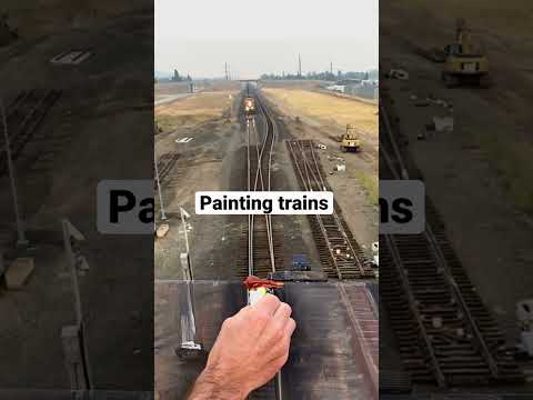 Painting the top of a train￼