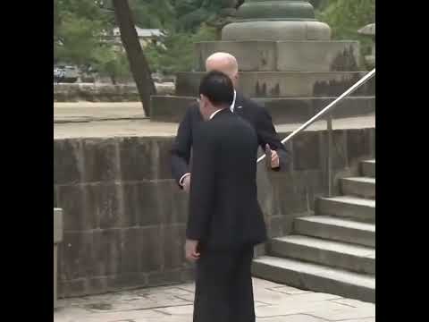 Bumbling Joe Biden Comes Close To Falling As He Walks Down The Stairs