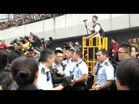 Hong Kong police arresting protesters