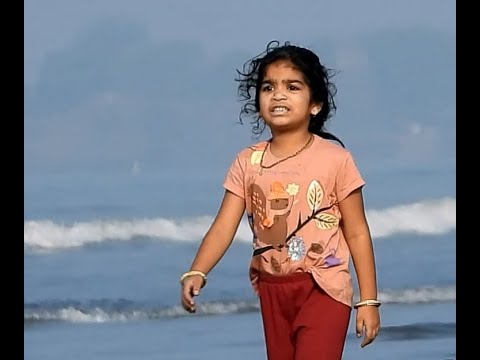 Playful Little Girl On Sea Beach