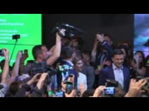 Zelenskiy reacts as exit polls suggest massive win