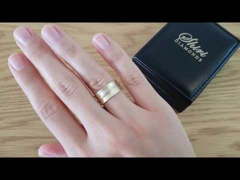 A video of  Yellow gold wedding ring abounds with hoops