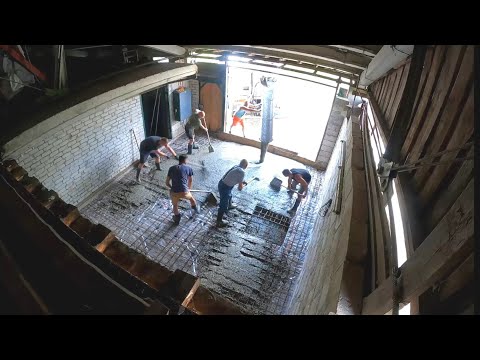 Pouring concrete floor for 2 post car lift, using power trowel for the first time.