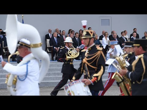 French military band plays Daft Punk medley, Trump looks bemused
