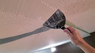 Repairing a bad seam in the popcorn ceiling.