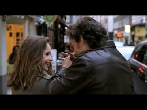 Trailer still: London interiors and rain-glossed streets paired with gentle piano textures