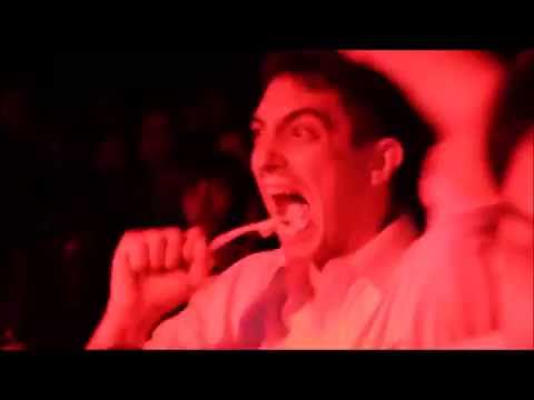 Guy brushes teeth at a Merzbow concert
