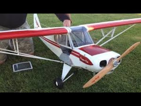 Huge rc petrol engine plane fast flying through runway