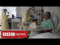Hospitals under pressure again as Covid admissions rise sharply - BBC News