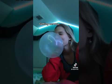 Girl blowing big bubblegum bubbles