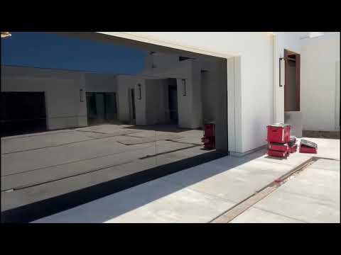 Elite Garage Door & Gate Repair crew installing a new automatic driveway gate system