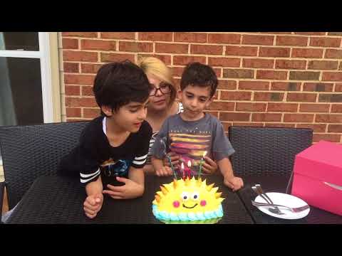 Matteen and Kadeer get cake for their first day of school