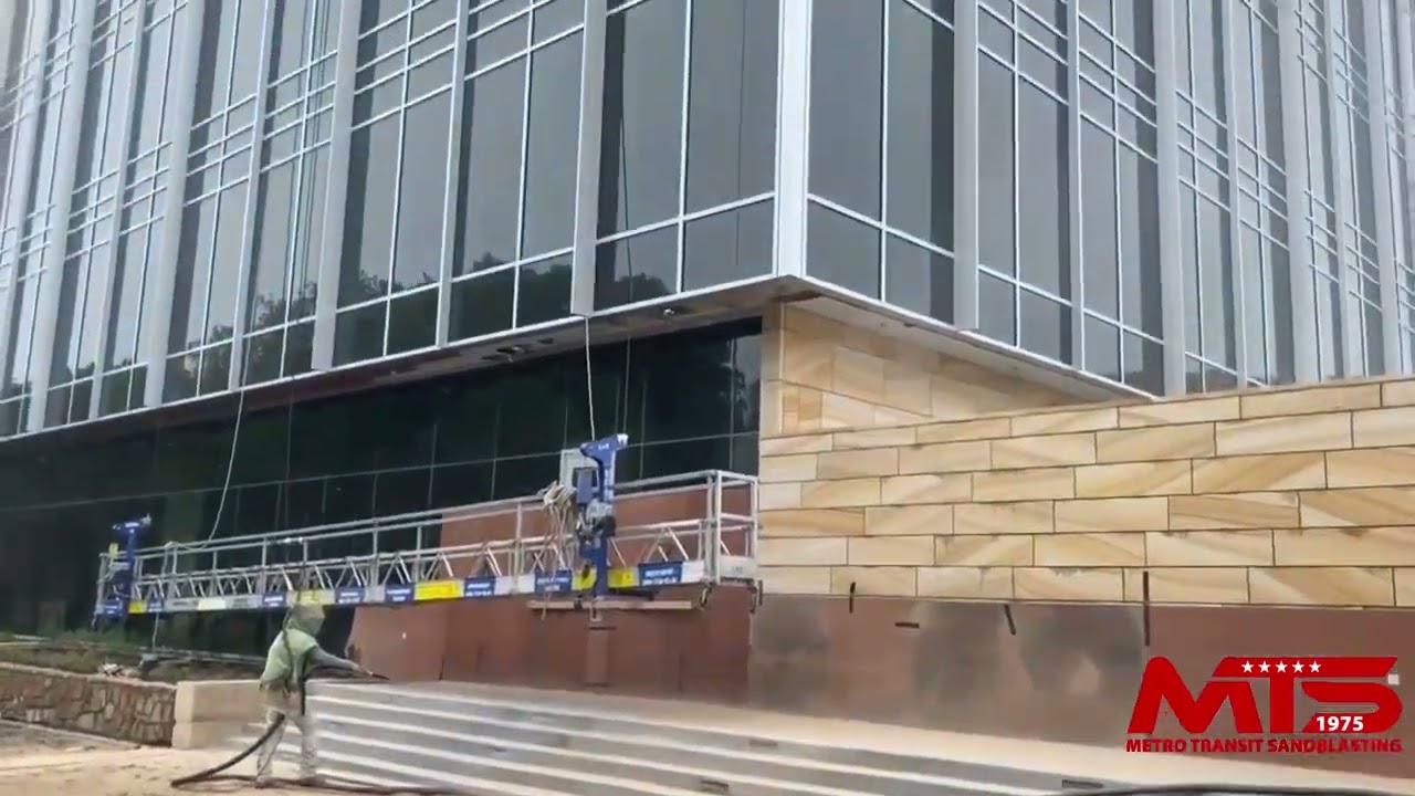 Sandblasting architectural concrete at Independent Financial building in McKinney, TX.