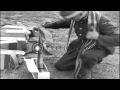 RAF ground crews arm British spitfire fighter aircraft with machine gun ammunitio...HD Stock Footage