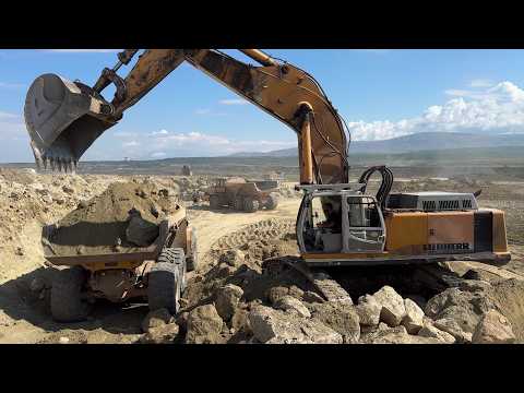 Liebherr 974 Excavator & Cat 352F  With Hydr. Hammer Loading Stone Layers In  Bell B50D - Ascon Ltd