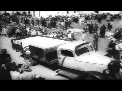 UNRRA Director Fiorello La Guardia watches grain being loaded on a train at Clima...HD Stock Footage