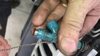 INSTALLING and testing fuel injectors in a jeep liberty
