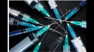 Syringe safety mechanisms