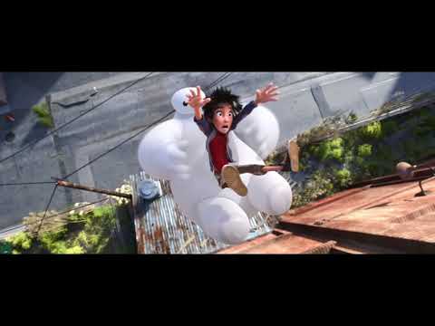 Hiro and Baymax rocket past red torii rooftops in a night flight sequence from the trailer