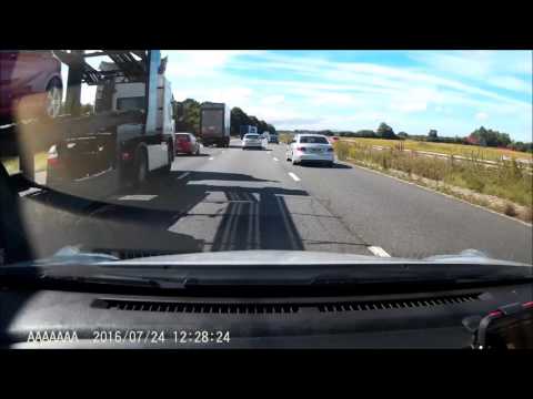 idiot tries to cut up a HGV