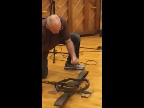 Man punches a bear trap.