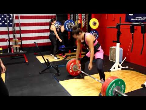 Female powerlifting team trains at Chaos Fitness in Berkley, MA