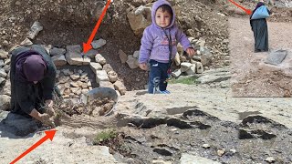 Orphaned mother and child in the mountain land: discovering a spring and building a water pond