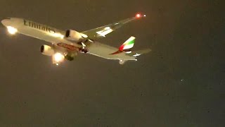 Flights landing at Dubai Airport in cloudy evening.