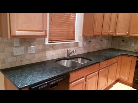 Peacock granite countertops-3 x 6 light travertine tile back...