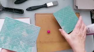 Gelli printing some grey board pieces and pages in a new art journal