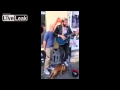 Street Musician playing Smalltown boy joined by ...
