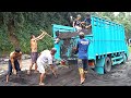 Black Sand Is Put Into The Isuzu Elf Truck Bed