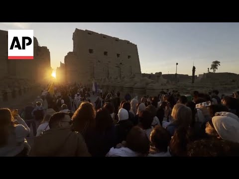 Visitors watch the sun align with a temple in Egypt on Winter Solstice