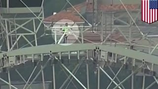 Tightrope walker Nik Wallenda crosses enormous Orlando ferris wheel - Video : TomoNews