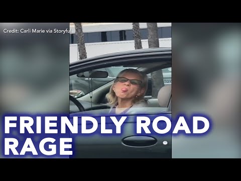 'Sorry, darling!' Friendly road rage incident caught on camera