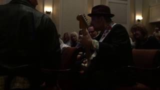 Ronnie Earl sitting in the crowd, jamming away...