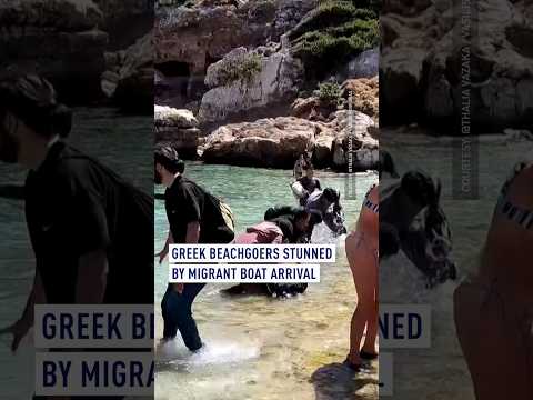 Greek beachgoers stunned by migrant boat arrival