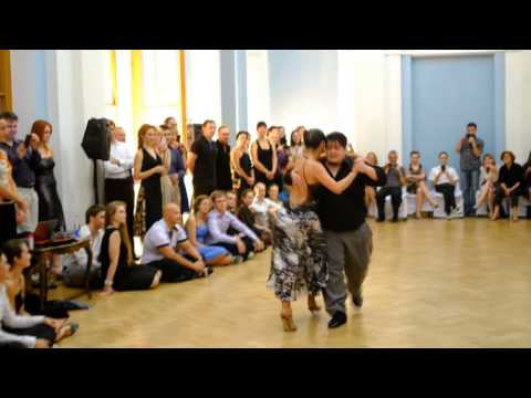  Alejandra Mantinan  and  Aoniken Quiroga  are  dancing  to  a  milonga