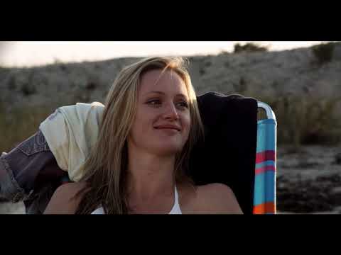 Nice Guy Johnny official trailer still: Johnny and Brooke on the Hamptons road at golden hour