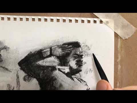 Thumbnail of Drawing a small face in charcoal