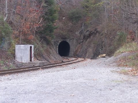 Train passing through tight tunnel hits wall. Scary tunnel
