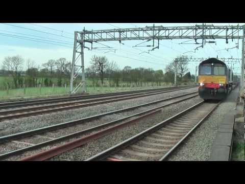 66430 on Mossend - Daventry intermodal and 70011 on Crewe - Warrington