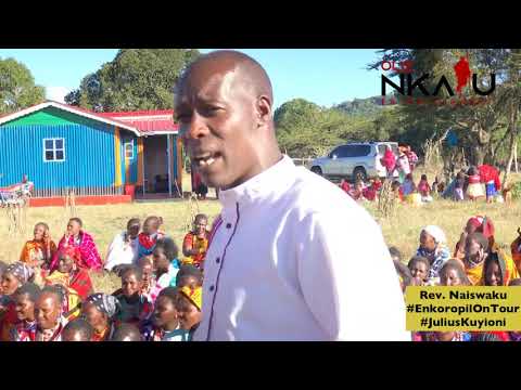 Ole Naiswaku preaching at Morijo Loita