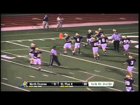 Michael Sikorski of St. Pius X intercepts and runs 72 yds for TD