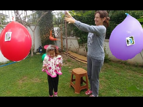 Kafada içleri sürpriz  dolu balon patlatmaca , eğlenceli çocuk videosu