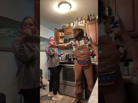 Man is pretending to fight with an imaginary friend to see how his wife will react!