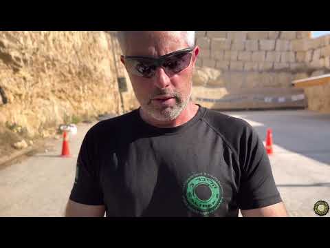 Col. Sharon the founder of Caliber 3 examines Springfield's new Hellcat pistol.