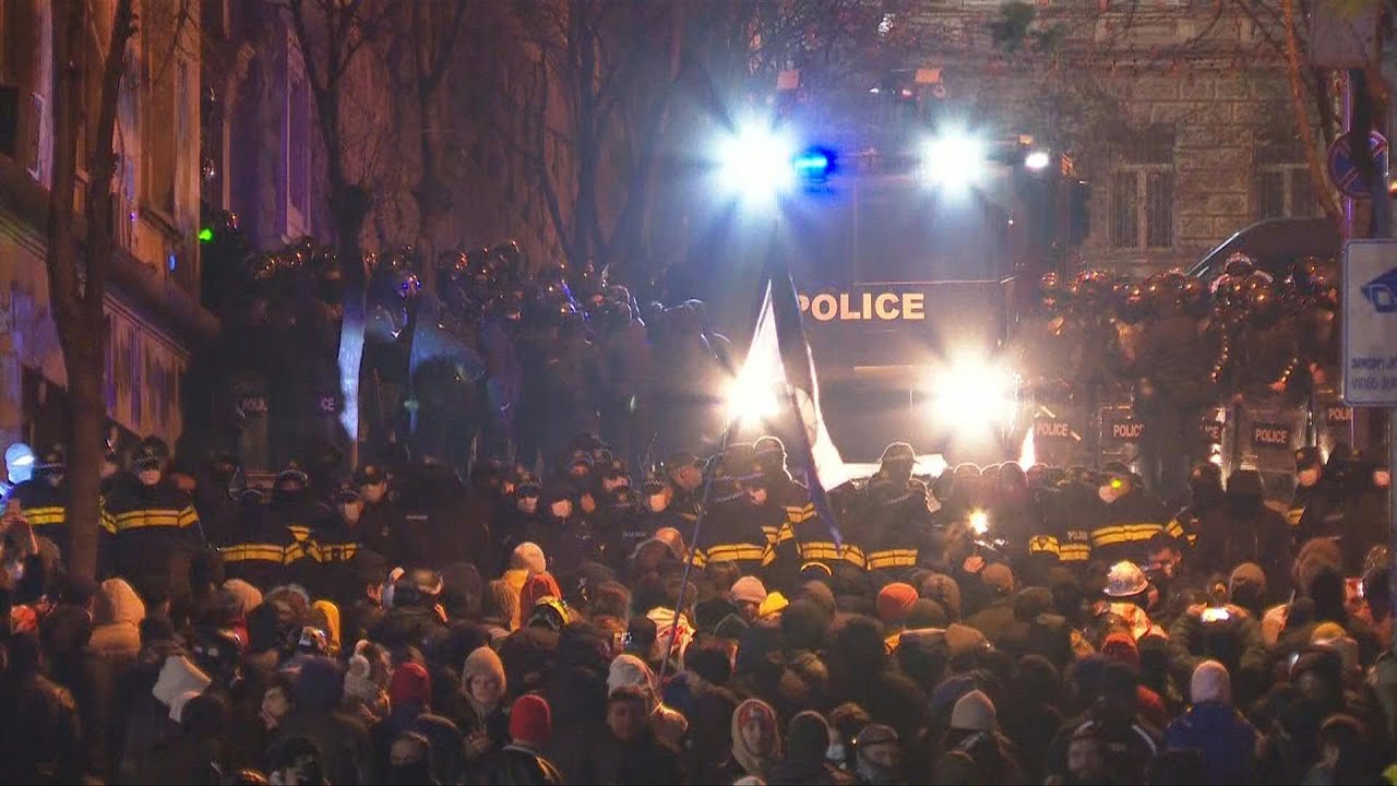Thousands rally in Georgia after police raid opposition offices | AFP